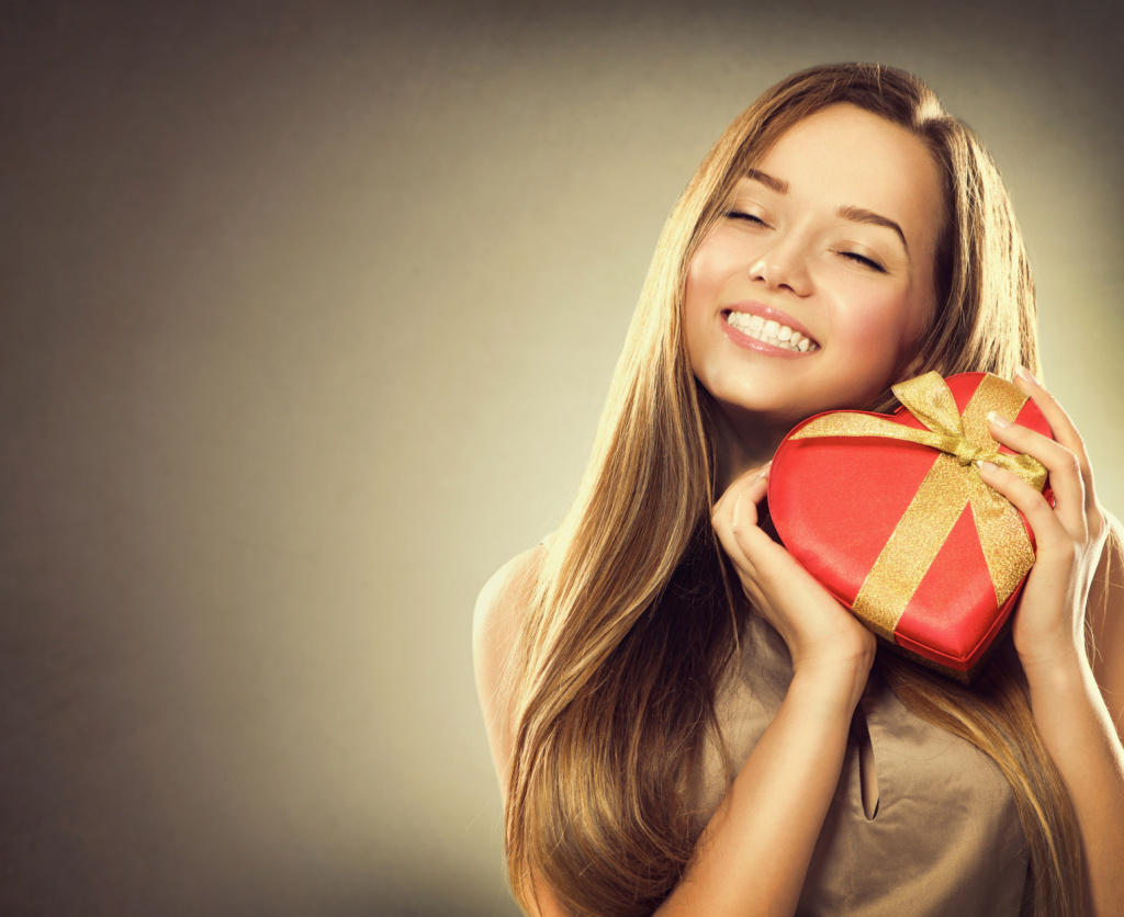 Beauty happy girl with Valentine gift box