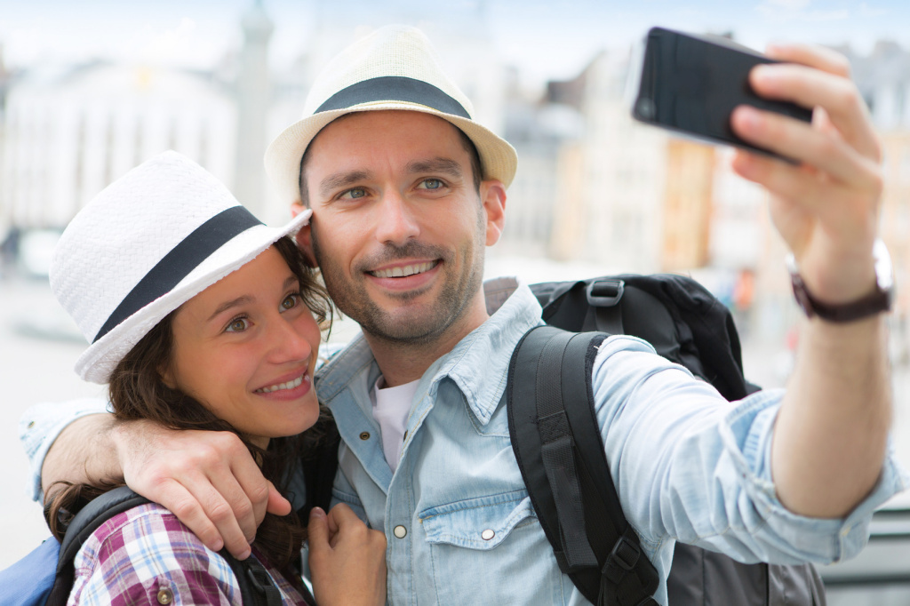 Young couple on holidays taking selfie